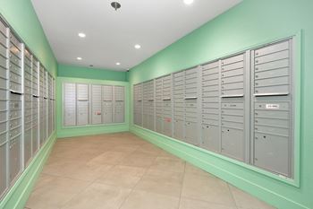 A bunch of lockers in a room with green walls